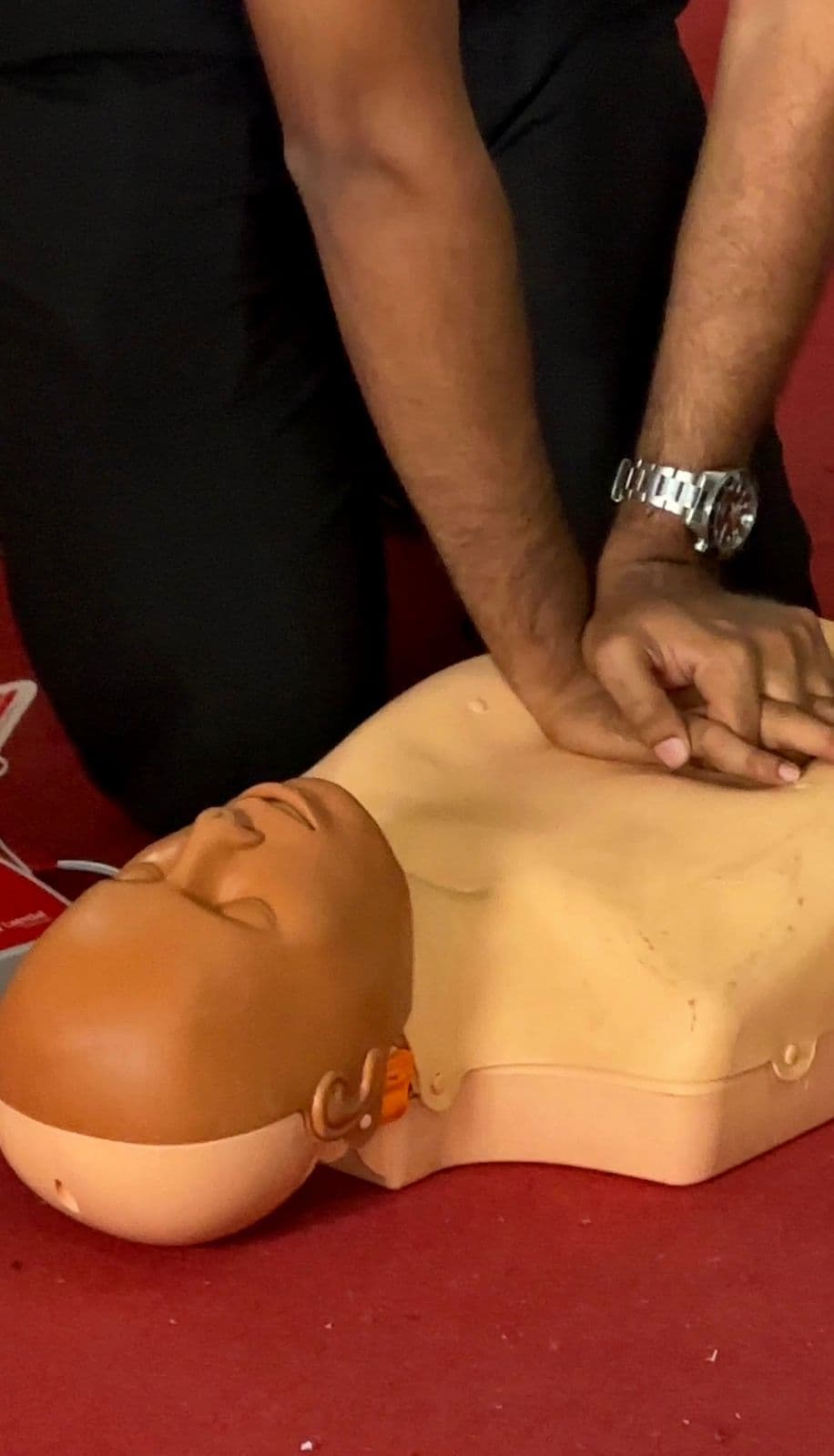 Practising chest compressions — training to save lives.