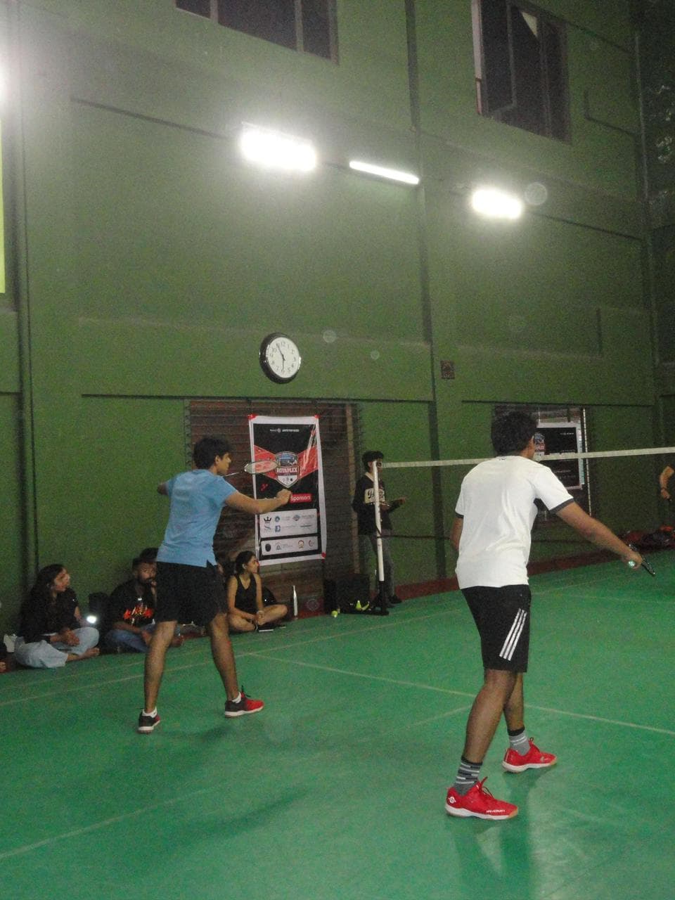On the badminton court — game on.