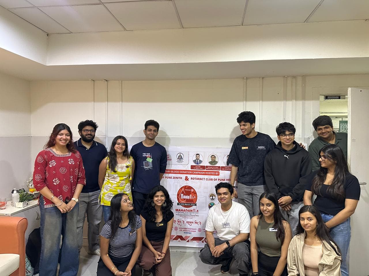 The full crew with the Mahadaan banner.